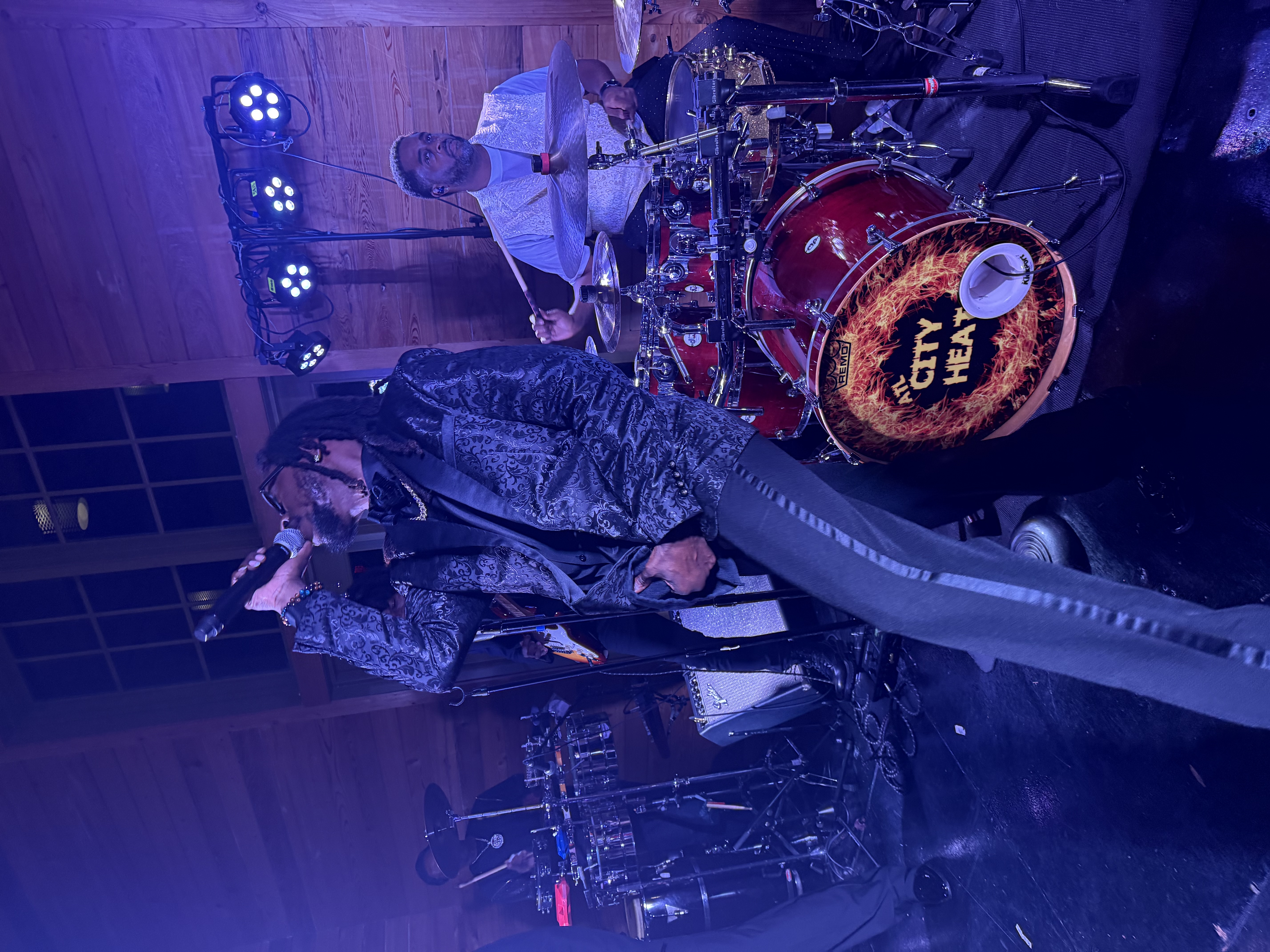 City Heat singer performing with the drummer