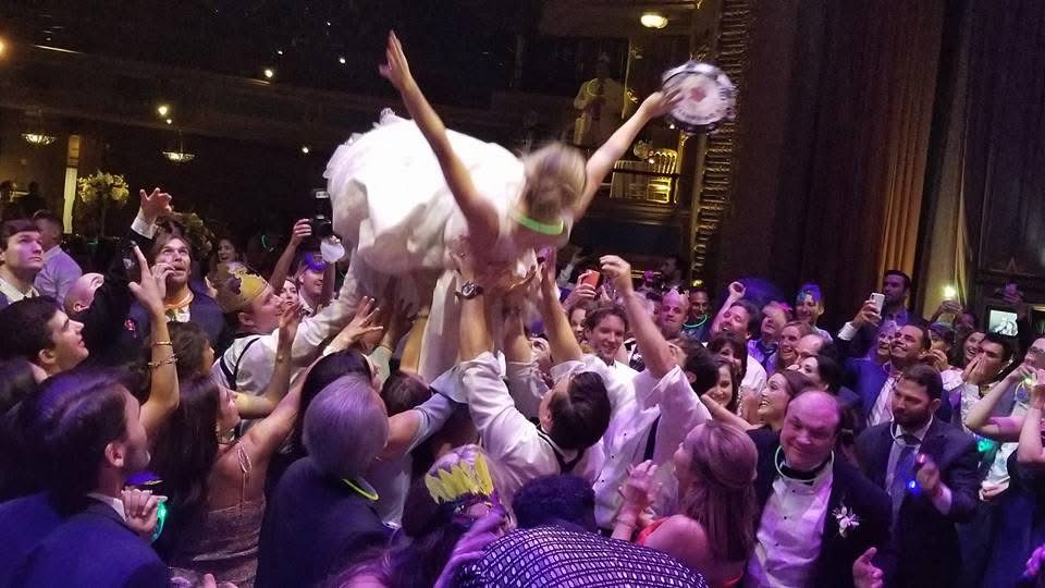 Wedding guests celebrating on the dance floor
